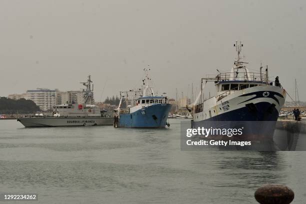 Fishing boats enter in the Mazara harbour after being held in Libya on December 20, 2020 in Mazara del Vallo, Italy. The 18 crew members of the...