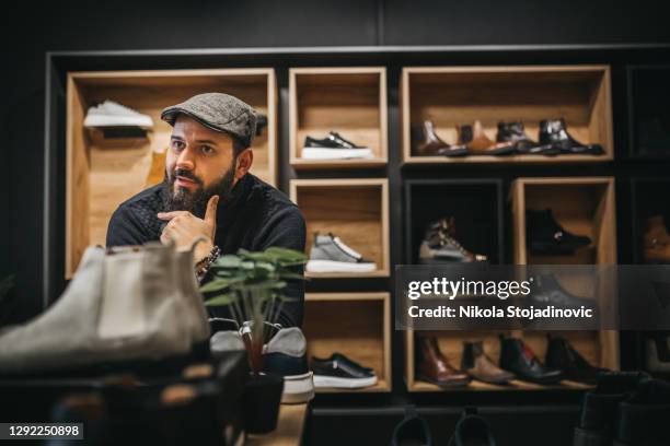 proud shoes owner - shoe seller imagens e fotografias de stock