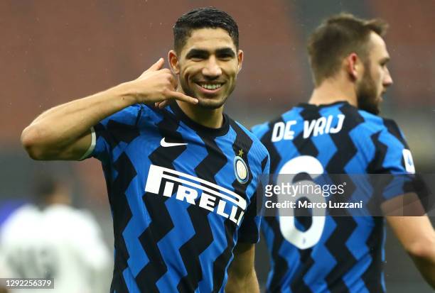 Achraf Hakimi of Inter Milan celebrates after scoring their team's first goal during the Serie A match between FC Internazionale and Spezia Calcio at...
