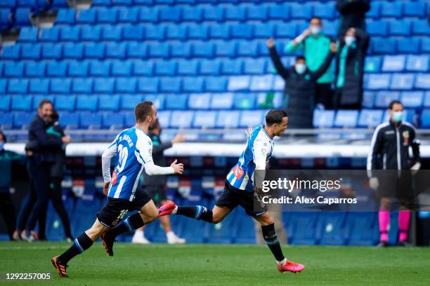 Raul de Tomas of RCD Espanyol celebrates with his teammate Sergi Darder after scoring the opening goal during the LaLiga SmartBank match between RCD...