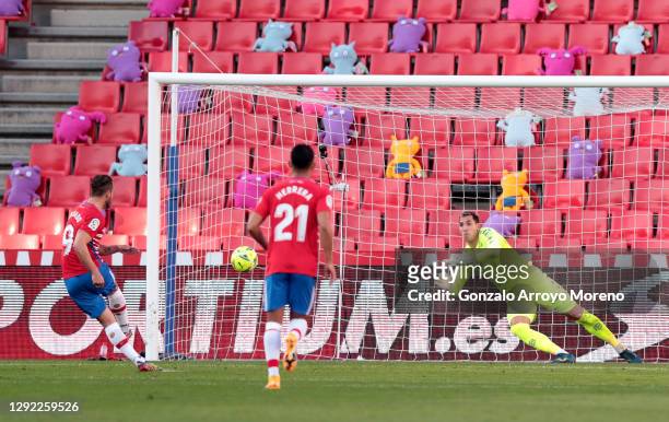 Roberto Soldado of Granada CF scores their sides first goal from the penalty spot past Joel Robles of Real Betis during the La Liga Santander match...