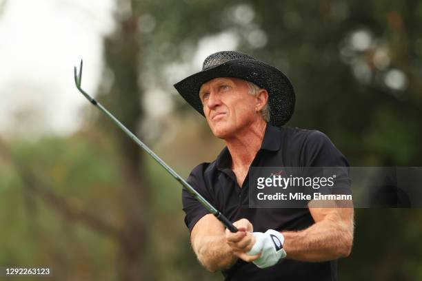 Greg Norman of Australia plays his shot from the fourth tee during the final round of the PNC Championship at the Ritz-Carlton Golf Club Orlando on...