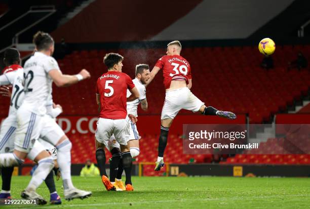Liam Cooper of Leeds United scores their team's first goal during the Premier League match between Manchester United and Leeds United at Old Trafford...