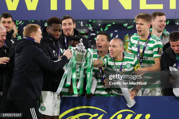 Neil Lennon, Manager of Celtic lifts the William Hill Scottish Cup with Scott Brown of Celtic after victory in a penalty shoot out in the William...