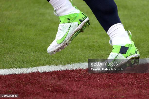 Detail of the shoes of quarterback Russell Wilson of the Seattle Seahawks as he warms up before the start of their game against the Washington...