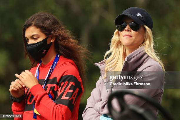 Sam Woods, daughter of Tiger Woods of the United States, and her mother Elin Nordegren look on during the final round of the PNC Championship at the...