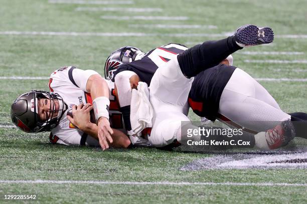 Sharrod Neasman of the Atlanta Falcons sacks Tom Brady of the Tampa Bay Buccaneers during the second quarter in the game at Mercedes-Benz Stadium on...