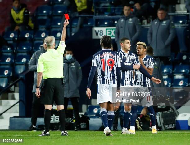 Jake Livermore of West Bromwich Albion is shown a red card by match referee, Martin Atkinson after VAR overturned a yellow card decision during the...