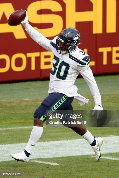 Running back Carlos Hyde of the Seattle Seahawks celebrates while crossing the goal line to score a 2third quarter touchdown against the Washington...