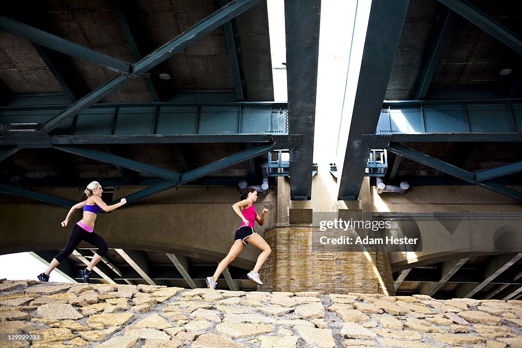 Two girlfriends exercising together.