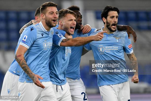 Ciro Immobile of SS Lazio celebrate a opening goal with his team mates during the Serie A match between SS Lazio and SSC Napoli at Stadio Olimpico on...