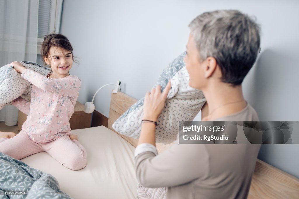 Girl and her mom having fun before bedtime