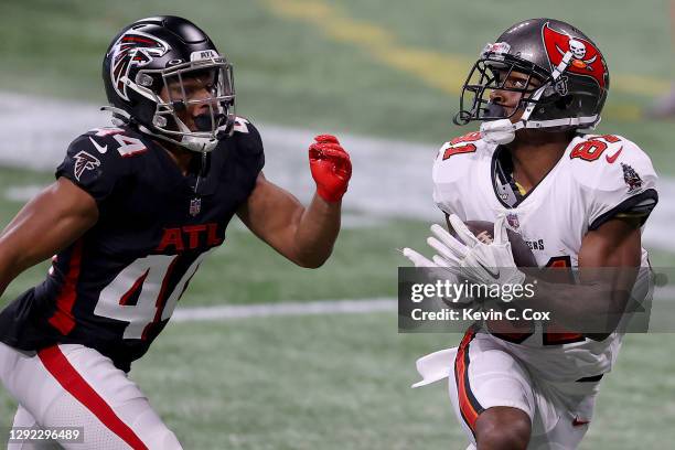 Antonio Brown of the Tampa Bay Buccaneers catches a 46 yard pass to score a touchdown against Tyler Hall of the Atlanta Falcons during the fourth...