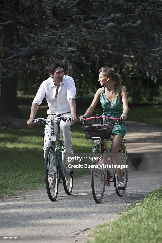 Young couple with bike in Turin, Italy.