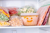 Frozen food in the freezer. Frozen vegetables, soup, ready meals