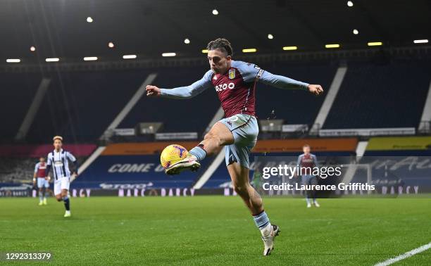 Jack Grealish of Aston Villa jumps to volley a shot at goal during the Premier League match between West Bromwich Albion and Aston Villa at The...