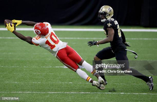 Tyreek Hill of the Kansas City Chiefs catches a pass against the New Orleans Saints during the fourth quarter in the game at Mercedes-Benz Superdome...