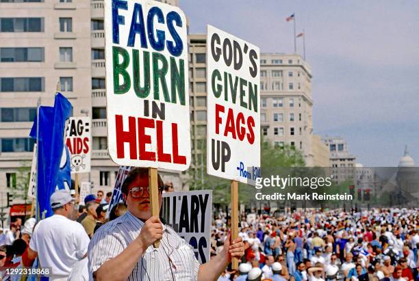Members of the Westboro Baptist Church from Topeka Kansas holding racist, hate, homophobic, signs protesting at the Lesbian and Gay March on...