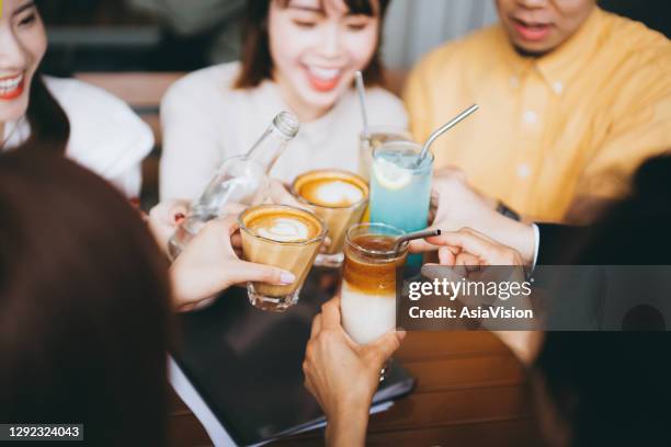 group of corporate co-workers having drinks with reusable stainless steel straws and celebrating after work - metal straw stock pictures, royalty-free photos & images