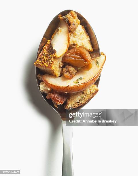 rye stuffing with italian sausage, pears, chestnut - rye grain stock-fotos und bilder