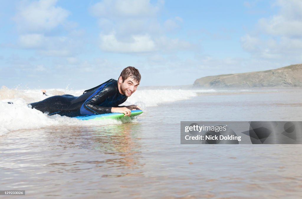 Bodyboarding in the surf