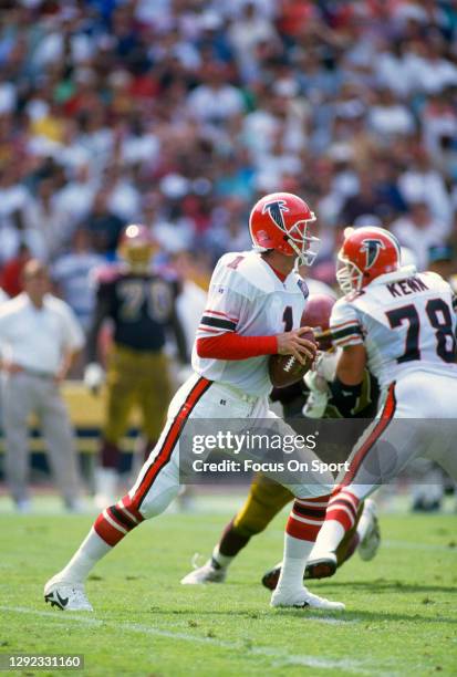 Jeff George of the Atlanta Falcons looks to pass against the Washington Redskins during an NFL football game September 25, 1994 at RFK Stadium in...