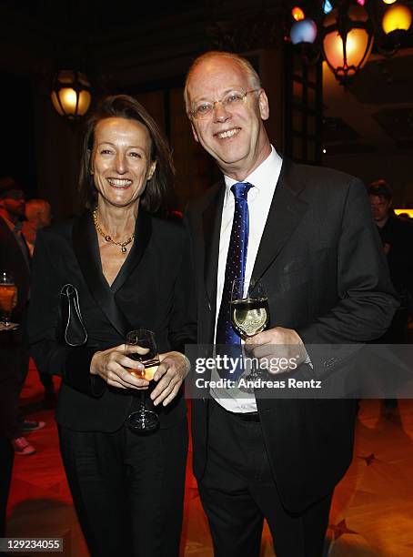 Rudolf Scharping and wife Kristina Pilati attend the 22nd Hesse Movie Award at Alte Oper on October 14, 2011 in Frankfurt am Main, Germany.