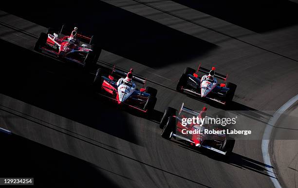 Vitor Meira of Brazil driver of the A. J. Foyt Enterprises Dallara Honda leads a pack of cars during practice for the IZOD IndyCar Series World...