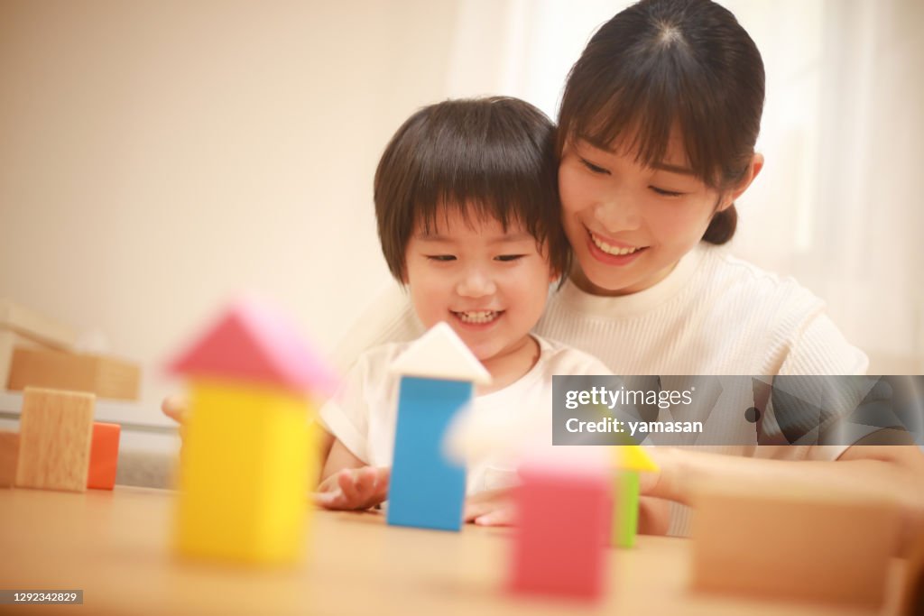 Parents and children playing with blocks