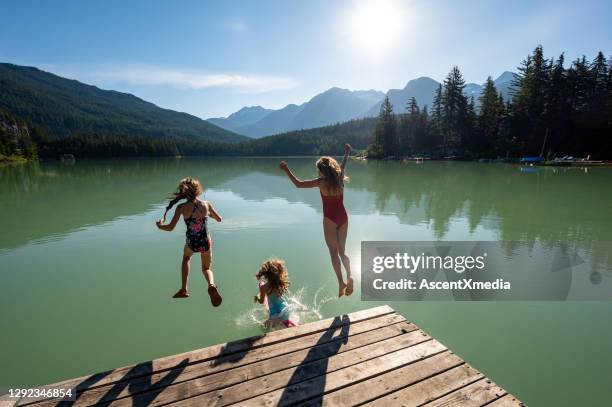 family on a mountain holiday - family lake stock pictures, royalty-free photos & images