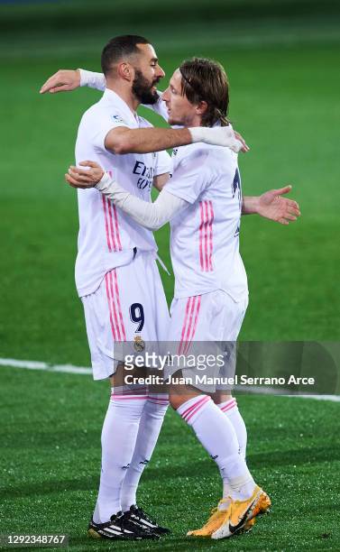 Luka Modric of Real Madrid celebrates with his teammates Karim Benzema of Real Madrid after scoring his team's second goal during the La Liga...