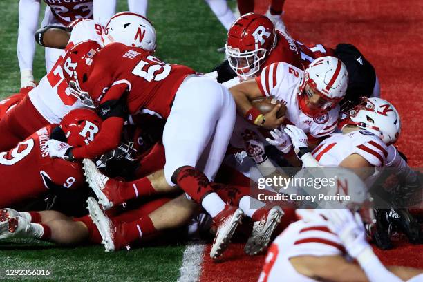 Adrian Martinez of the Nebraska Cornhuskers scores a touchdown during the fourth quarter at SHI Stadium on December 18, 2020 in Piscataway, New...