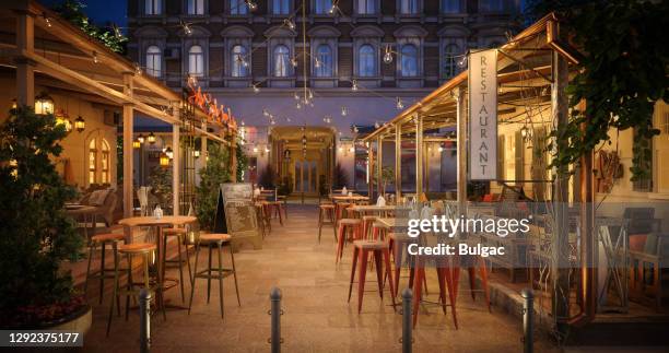 empty outdoor restaurant at dusk - restaurant outside stock pictures, royalty-free photos & images