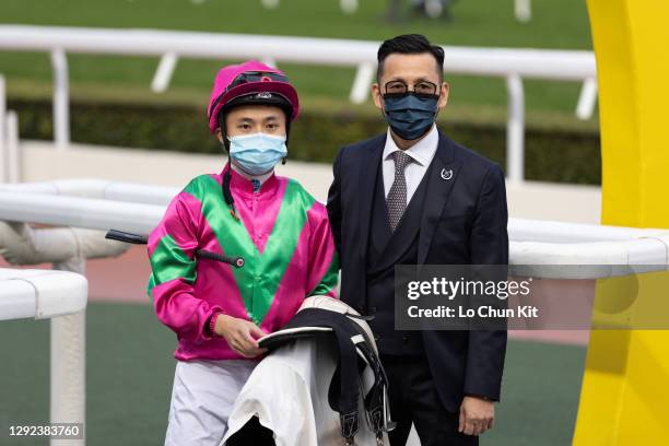 Jockey Matthew Poon Ming-fai and trainer Frankie Lor Fu-chuen celebrate after Celestial Power winning the Race 9 Firecracker Vine Handicap at Sha Tin...