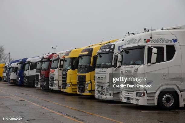 Lorries heading to Europe park in a service station as they wait for travel restrictions to be lifted the M20 towards Dover on December 21, 2020 in...