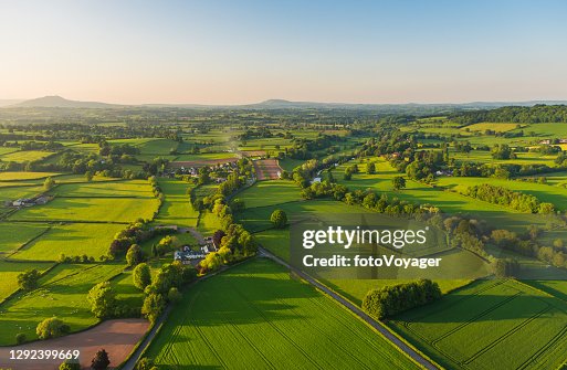 Aerial photograph rural landscape farms villages picturesque green patchwork pasture