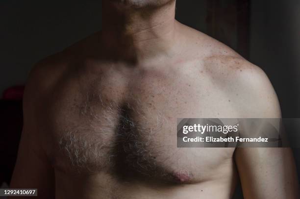 man's chest and neck, close-up - brustbereich stock-fotos und bilder