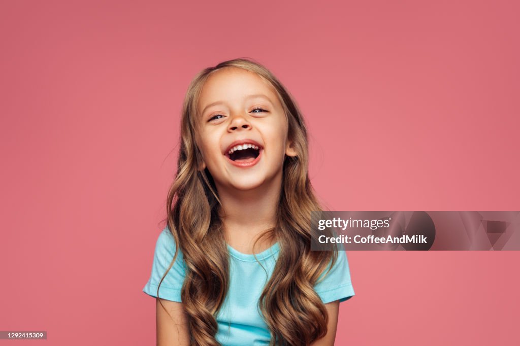 Funny girl on pink background