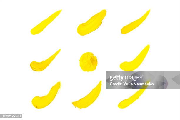 set of yellow paint strokes. - acrylic painting stock pictures, royalty-free photos & images