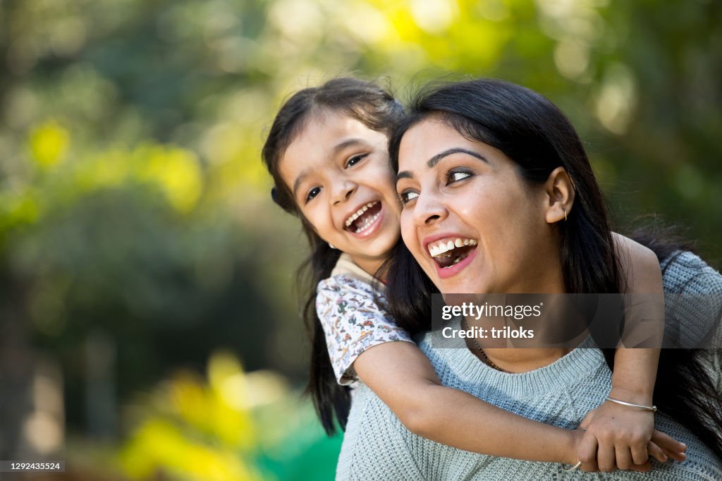 Mother and daughter having fun at the park