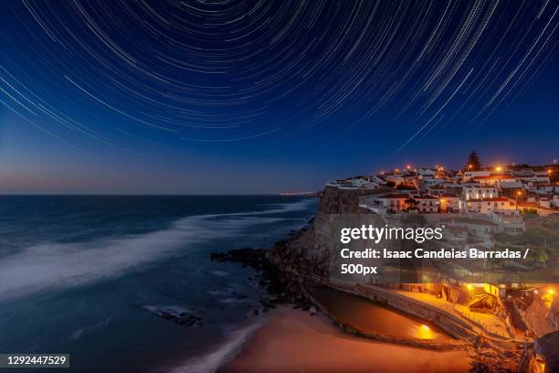 scenic view of sea against sky at night,azenhas do mar,colares,portugal - azenhas do mar imagens e fotografias de stock