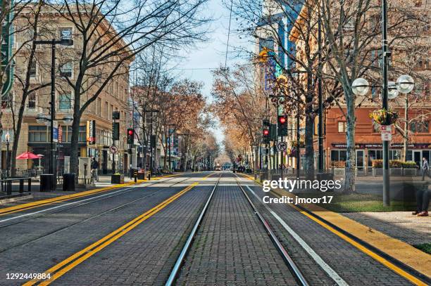state capital street downtown with light rail tracks - sacramento stock pictures, royalty-free photos & images