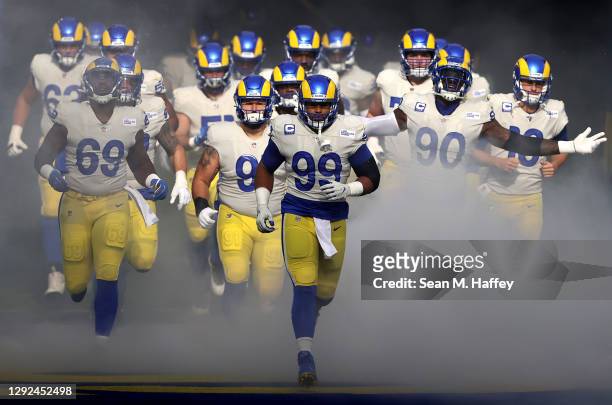 Aaron Donald of the Los Angeles Rams leads the team out to the field prior to facing the New York Jets at SoFi Stadium on December 20, 2020 in...