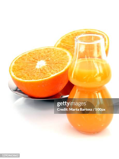 close-up of orange fruits against white background - orange juice glass white background stock-fotos und bilder