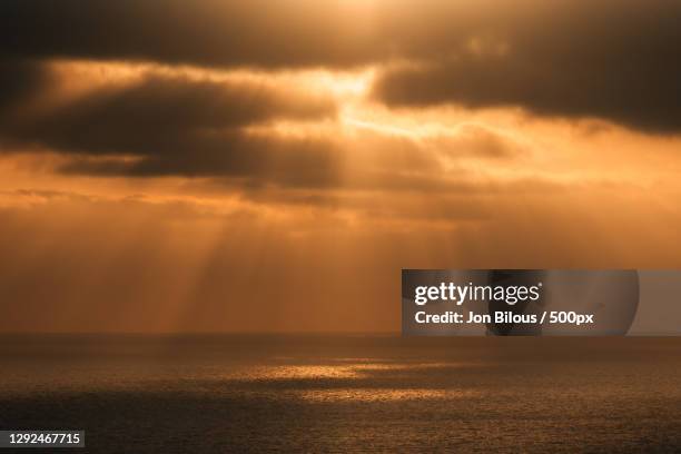 scenic view of sea against dramatic sky during sunset - san diego landscape stock pictures, royalty-free photos & images