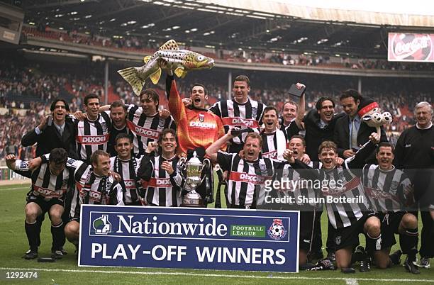 The Grimsby Town team celebrate after the Nationwide League Division Two play-off final against Northampton Town at Wembley Stadium in London....