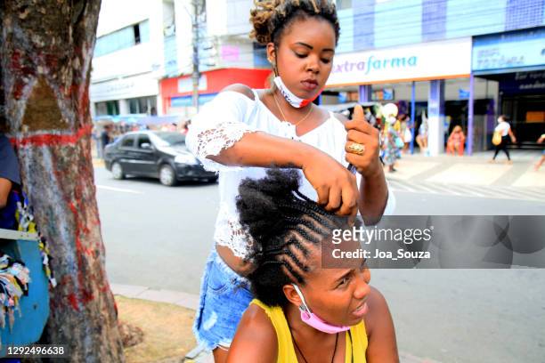 black woman braiding beautiful - cornrows stock pictures, royalty-free photos & images