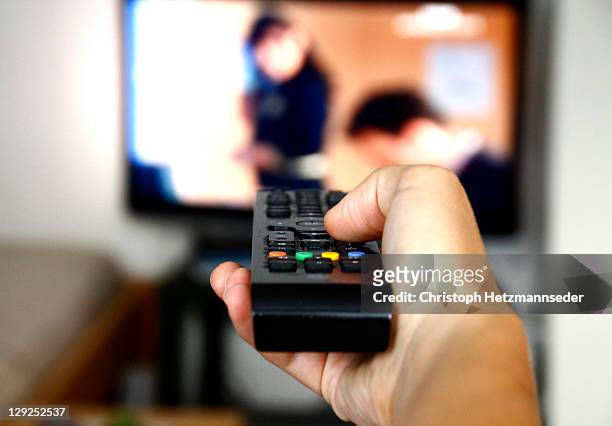 tv channel zapping - changing channels stock pictures, royalty-free photos & images