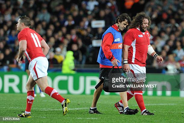 Wales' prop Adam Jones leaves the filed after injury during the 2011 Rugby World Cup semi-fianl match Wales vs France at the Eden Park in Auckland on...