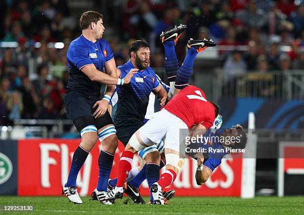 Sam Warburton of Wales up ends Vincent Clerc of France during semi final one of the 2011 IRB Rugby World Cup between Wales and France at Eden Park on...